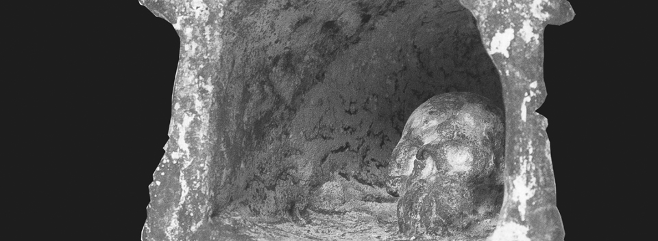 Work by Enzo Cucchi depicting a cave with a skull inside